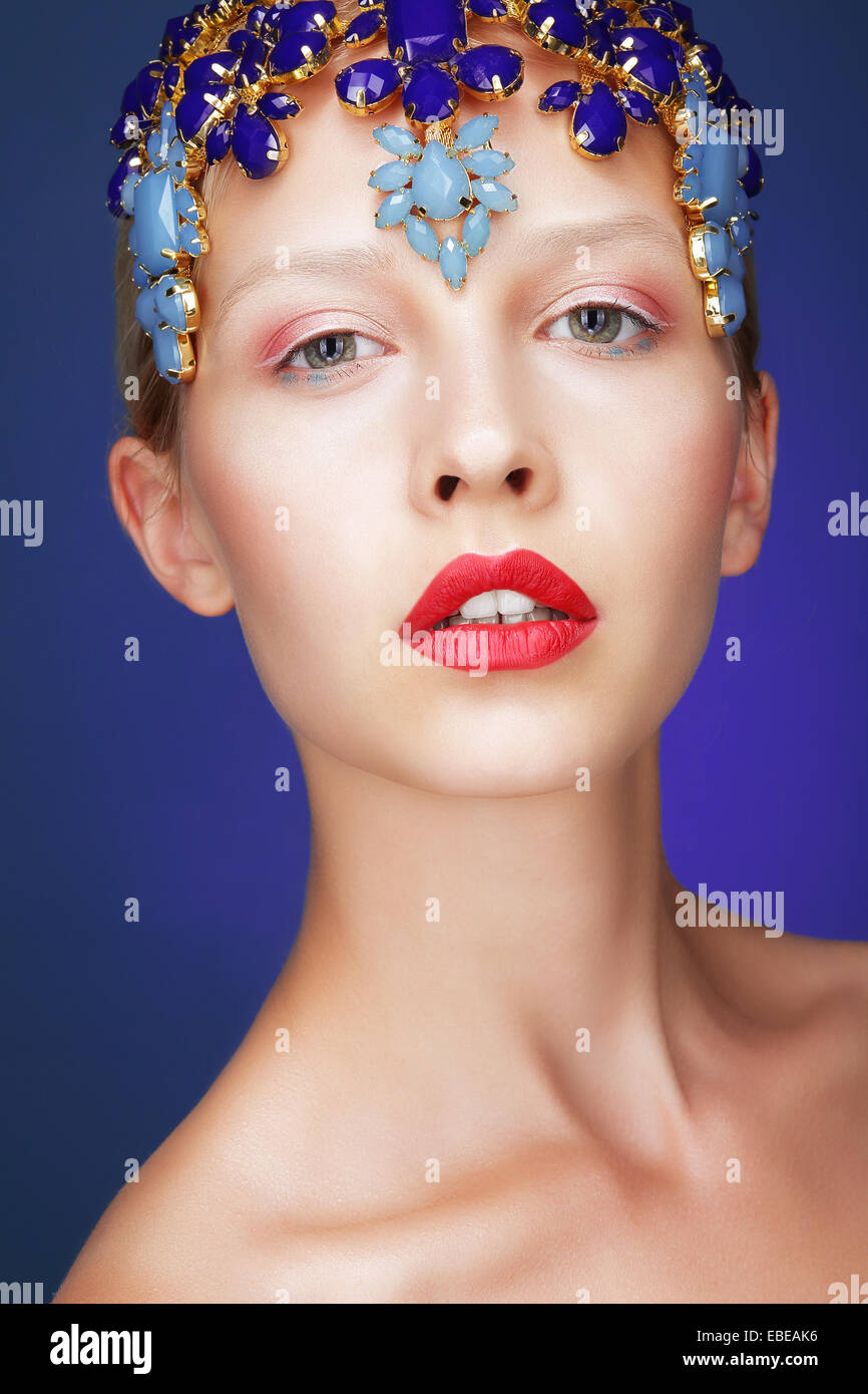 Artistry. Studio Portrait of Young Woman with Jewels Stock Photo
