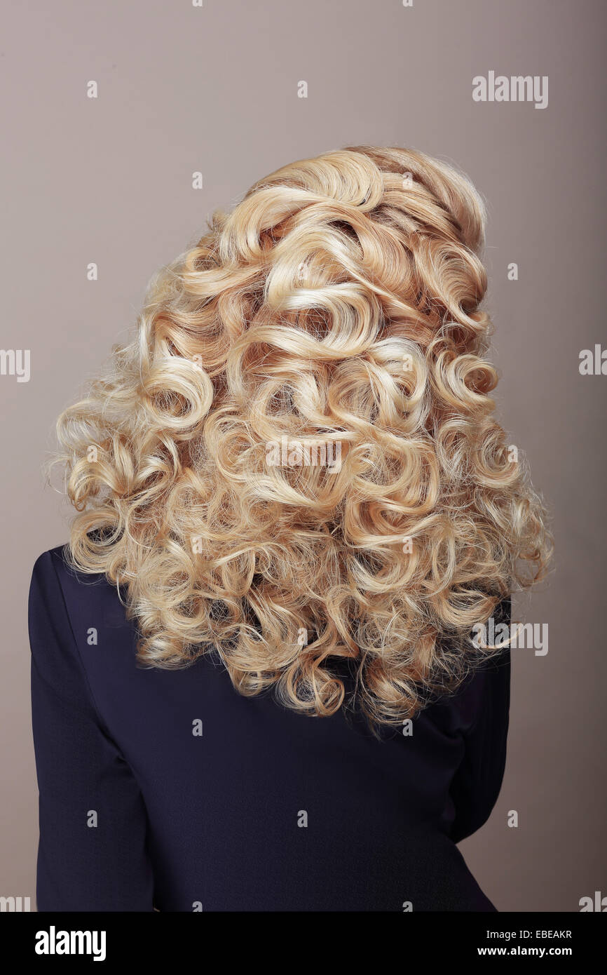Rear View of Woman with Frizzy Ashen  Hairs. Festive Braided Hairdo Stock Photo