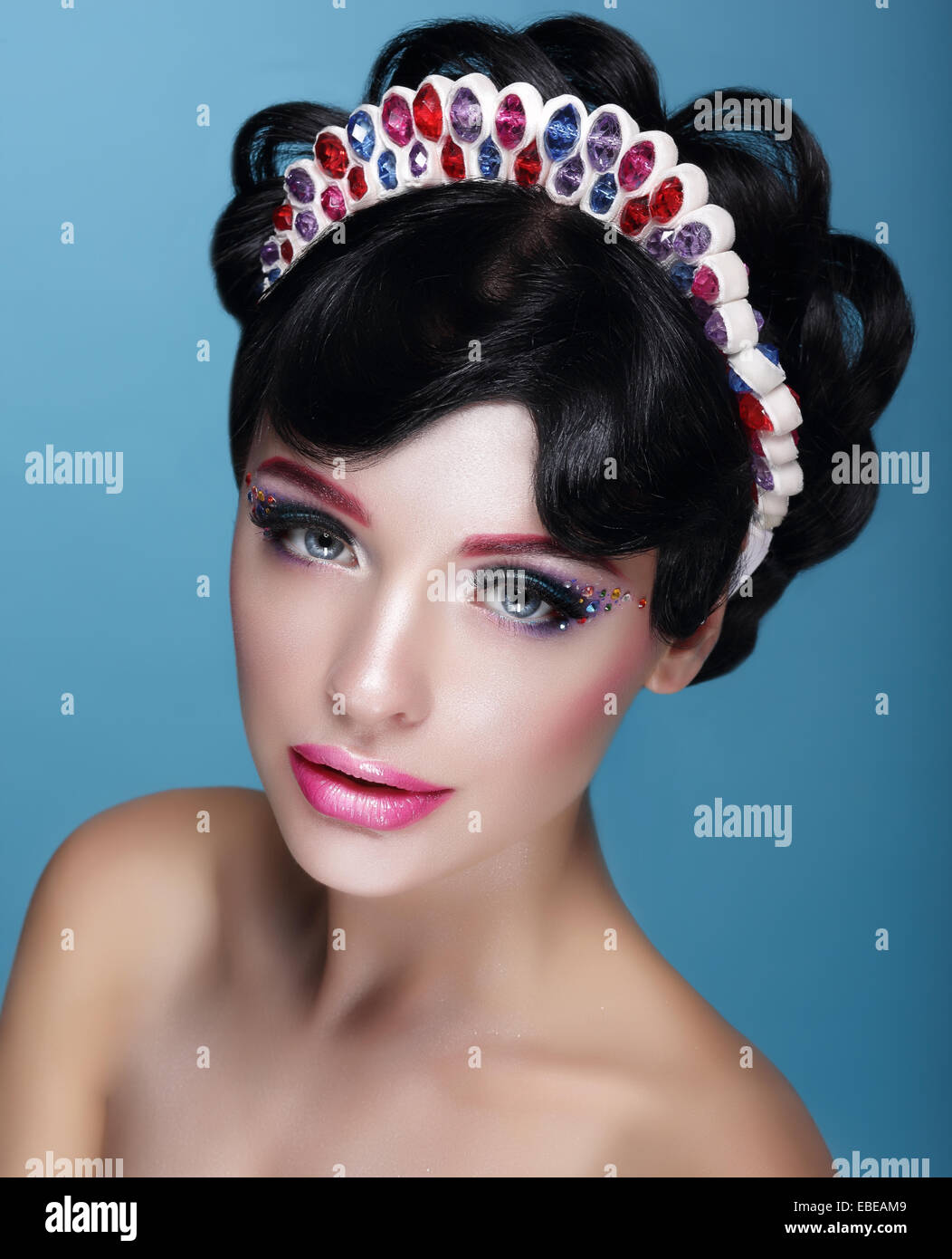 Glamor. Beautiful Brunette in Crown with Jewels Stock Photo