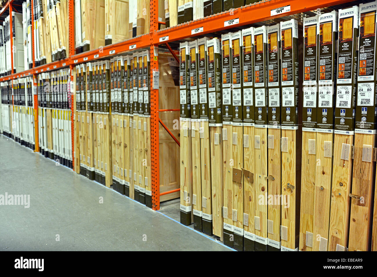 A row of many wooden doors for sale at Home Depot in College Point, Queens, New York City Stock Photo