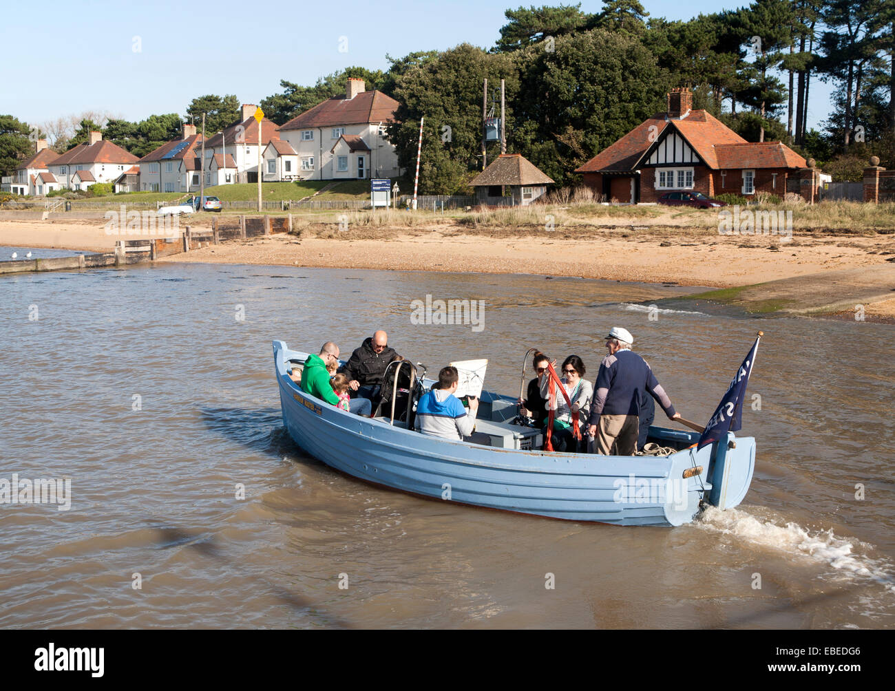 Small ferry boat crossing River Deben between Bawdsey Quay and