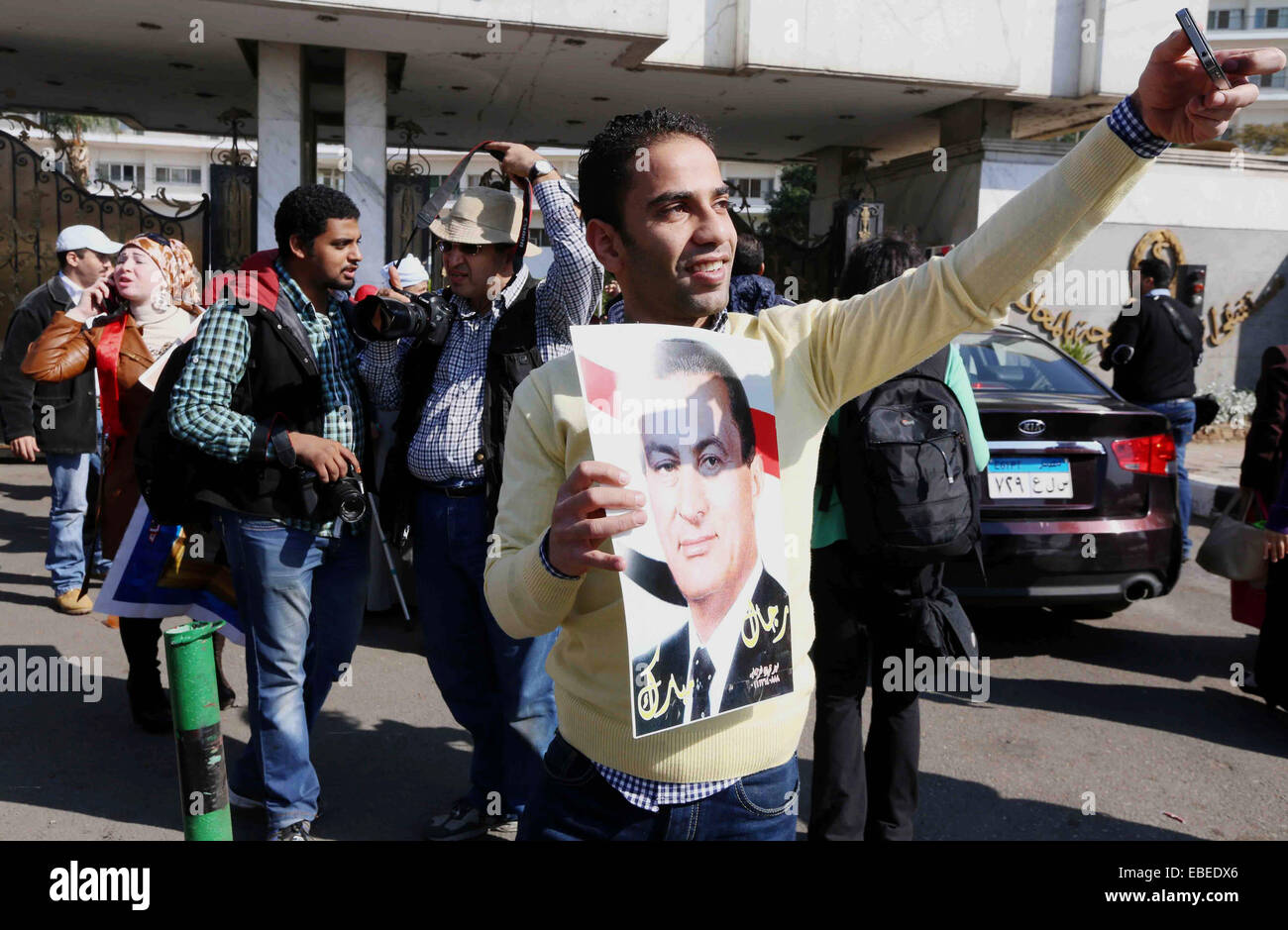 Cairo, Egypt. 29th Nov, 2014. Supporters of former Egyptian President Hosni Mubarak show their feeling, as they hear his verdict at Maadi Military Hospital in Cairo, Egypt, Saturday, Nov. 29, 2014. An Egyptian court on Saturday dismissed murder charges against Mubarak in connection with the killing of protesters in the 2011 uprising that ended his nearly three-decade reign © Amr Sayed/APA Images/ZUMA Wire/Alamy Live News Stock Photo