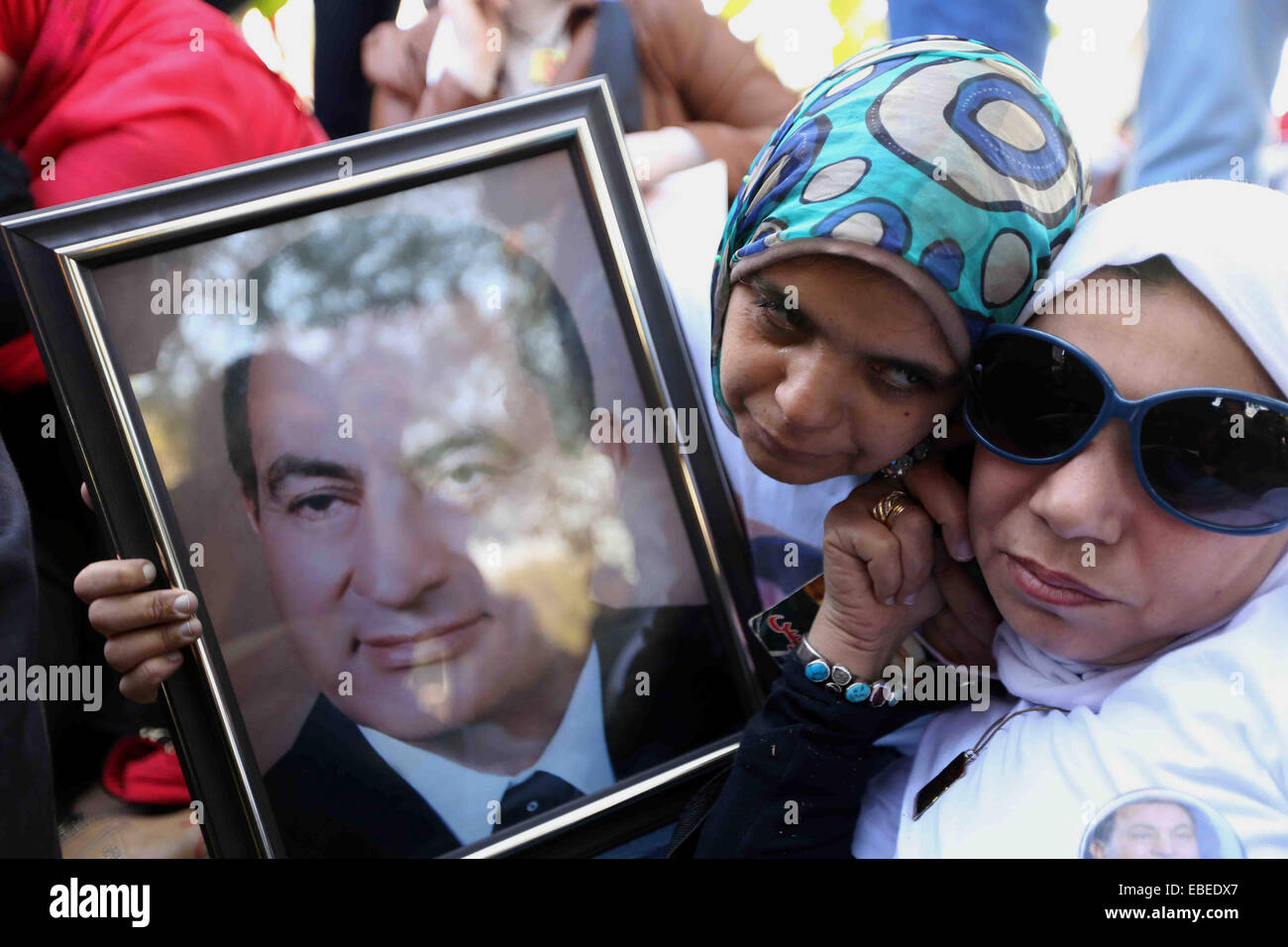Cairo, Egypt. 29th Nov, 2014. Supporters of former Egyptian President Hosni Mubarak listen to court proceedings at Maadi Military Hospital in Cairo, Egypt, Saturday, Nov. 29, 2014. An Egyptian court on Saturday dismissed murder charges against Mubarak in connection with the killing of protesters in the 2011 uprising that ended his nearly three-decade reign. Saturday's verdict concludes Mubarak's retrial along with his two sons, his security chief and six top security commanders, who were all acquitted © Amr Sayed/APA Images/ZUMA Wire/Alamy Live News Stock Photo