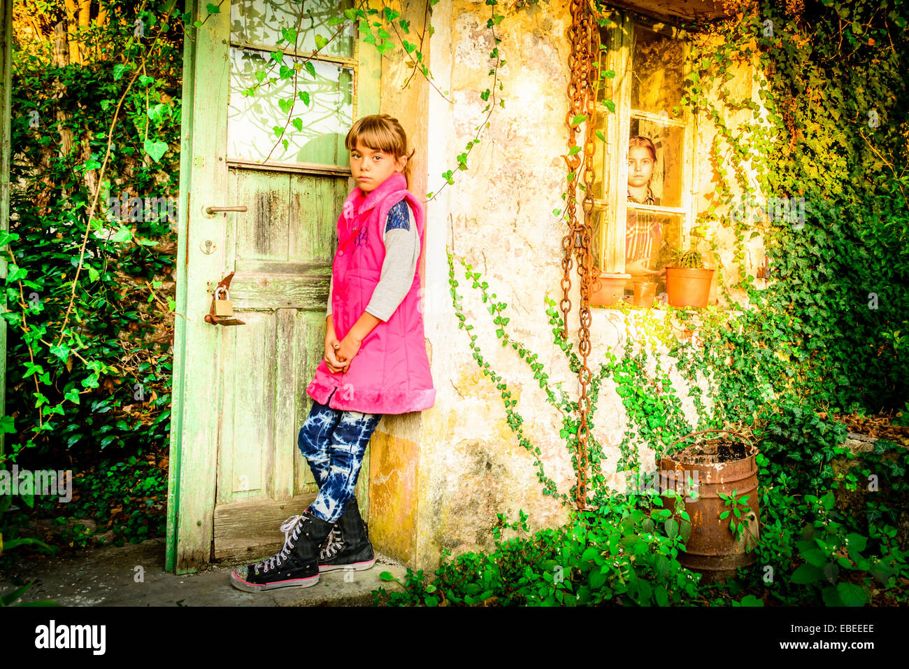 Little girl standing in front of the doors Stock Photo - Alamy