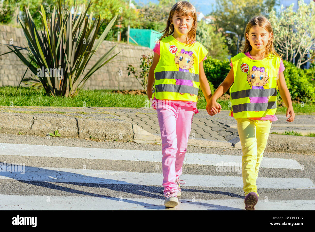 Elementary school kids  crossing the street Stock Photo