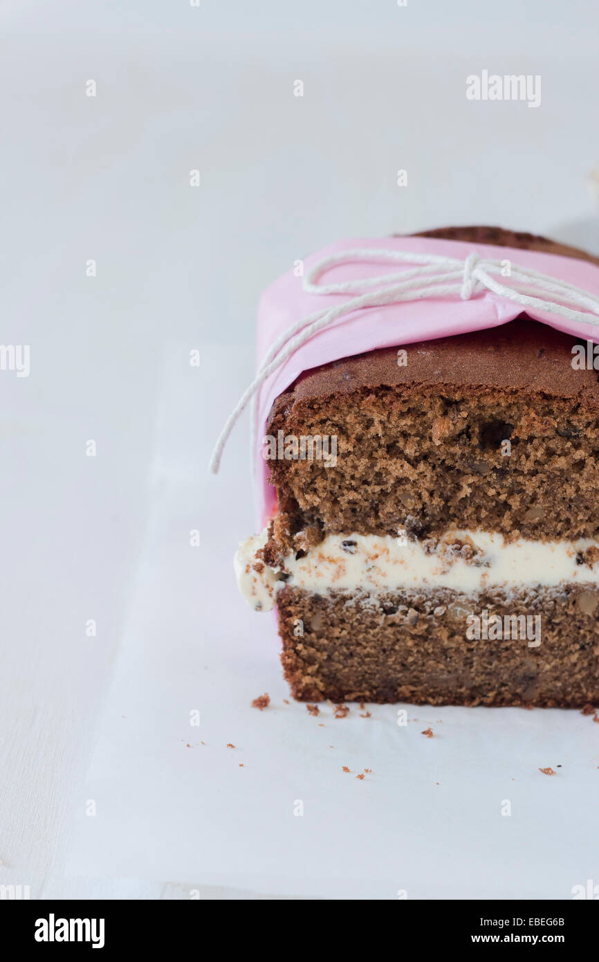 Section of walnut and coffee cake with cream filling, ideal for