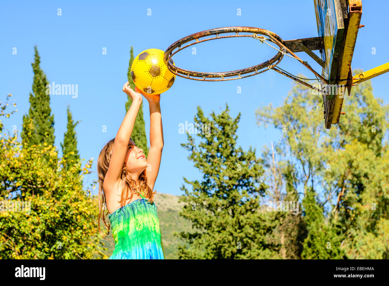 Seven year old girl playing basketball Stock Photo Alamy