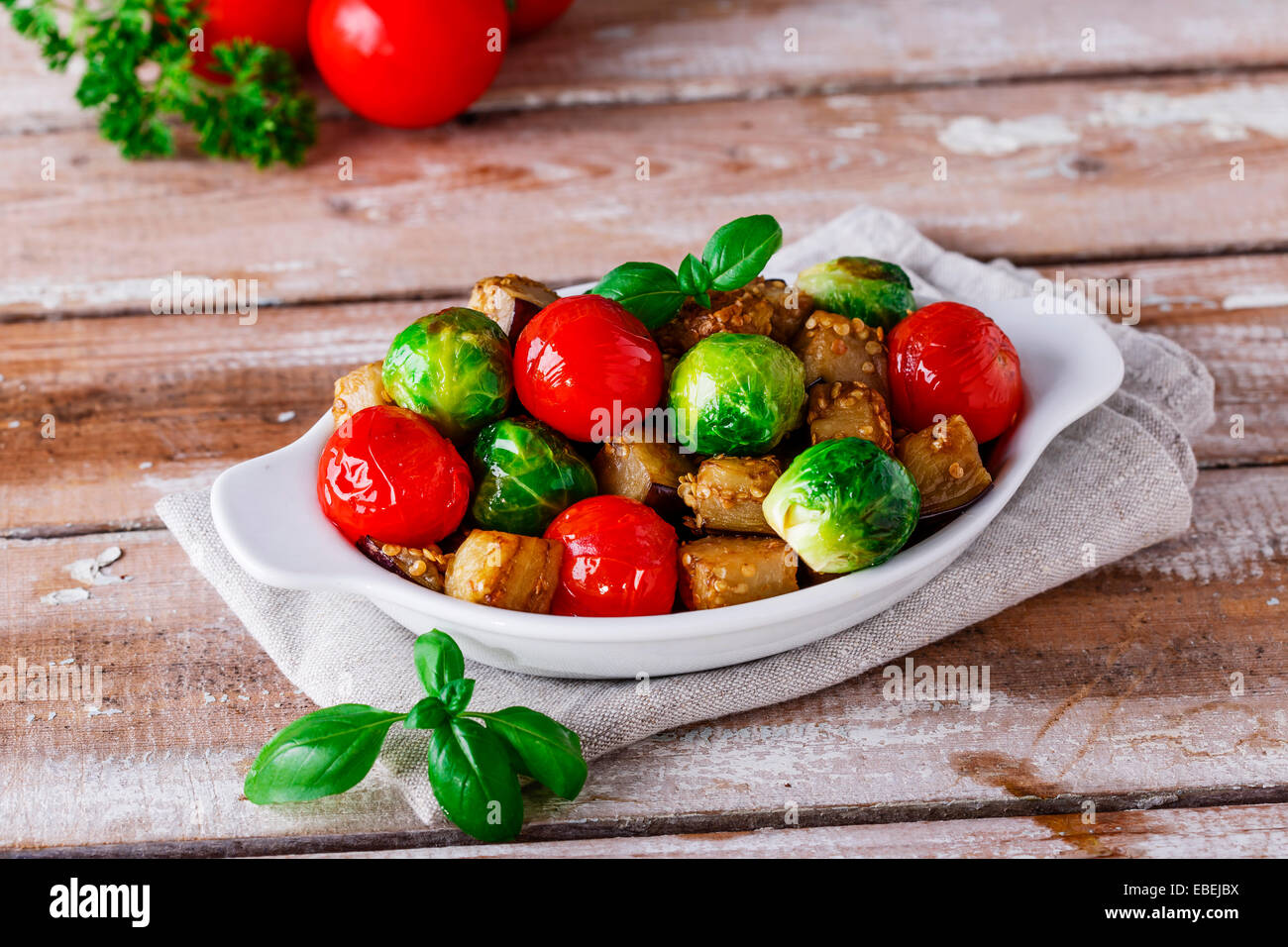 roasted vegetables eggplant, brussel sprouts, tomatoes basil Stock Photo