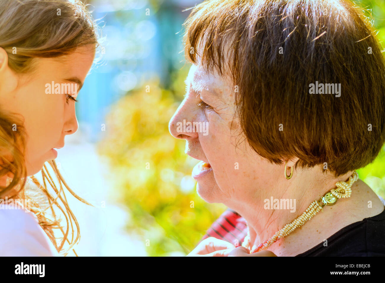 Grandmother  having a conversation with her Granddaughter Stock Photo