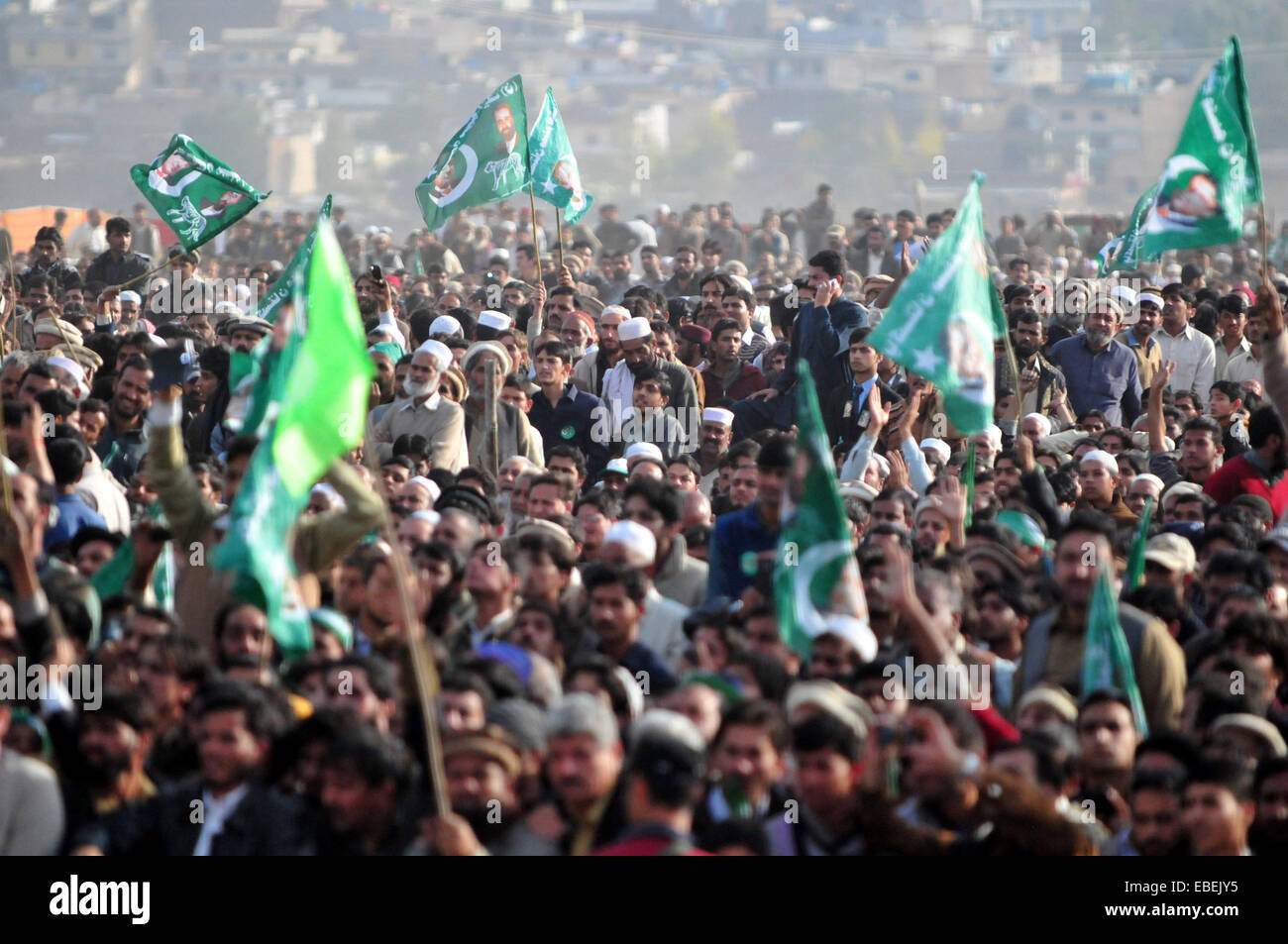 Havelian. 29th Nov, 2014. Supporters of ruling party Pakistan Muslim League-Nawaz (PML-N) gathered during a public meeting in northwest Pakistan's Havelian on Nov. 29, 2014. Pakistani Prime Minister Nawaz Sharif addressing a huge public meeting at Havelian on Saturday said that the multi-dimensional projects being undertaken by PML-N government would make Pakistan an Asian tiger. Credit:  Ahmad Kamal/Xinhua/Alamy Live News Stock Photo