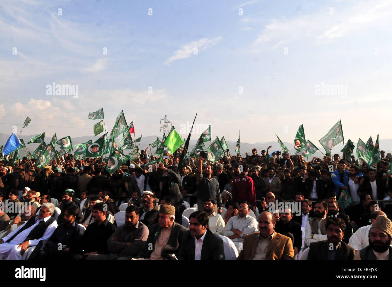 Havelian. 29th Nov, 2014. Supporters of ruling party Pakistan Muslim League-Nawaz (PML-N) gathered during a public meeting in northwest Pakistan's Havelian on Nov. 29, 2014. Pakistani Prime Minister Nawaz Sharif addressing a huge public meeting at Havelian on Saturday said that the multi-dimensional projects being undertaken by PML-N government would make Pakistan an Asian tiger. Credit:  Ahmad Kamal/Xinhua/Alamy Live News Stock Photo