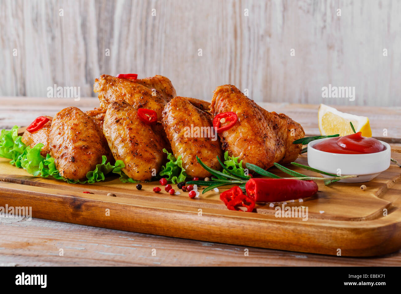 fried chicken wings with red sauce and French fries Stock Photo