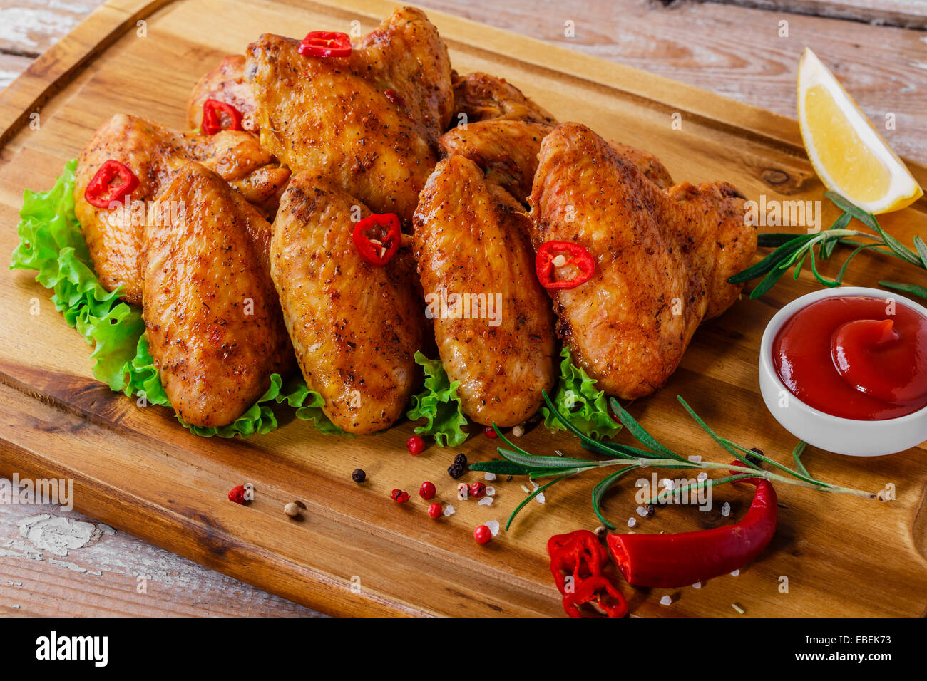 fried chicken wings with red sauce and French fries Stock Photo