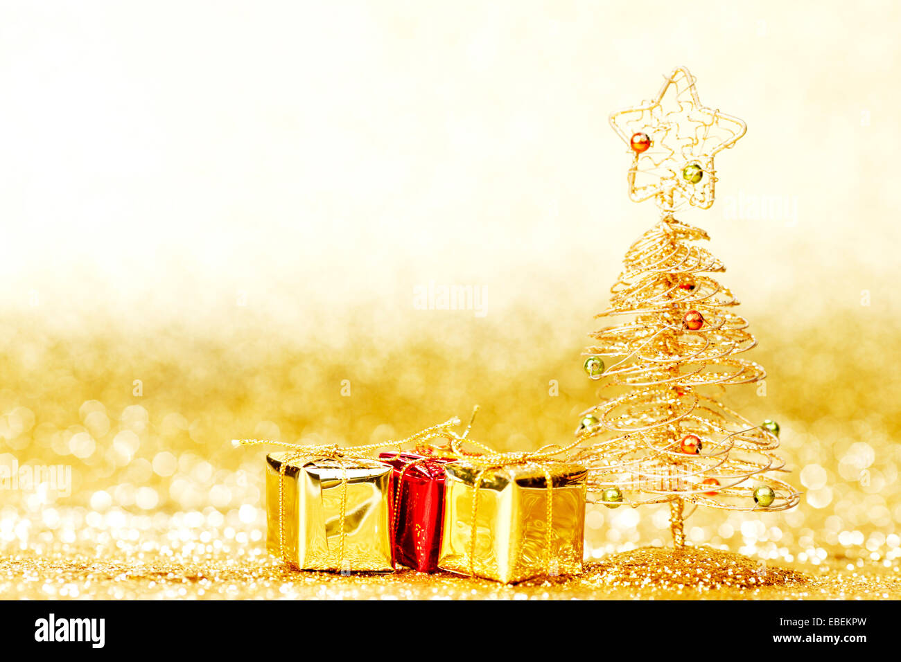 Toy golden decorative Christmas tree on glitter background Stock Photo ...