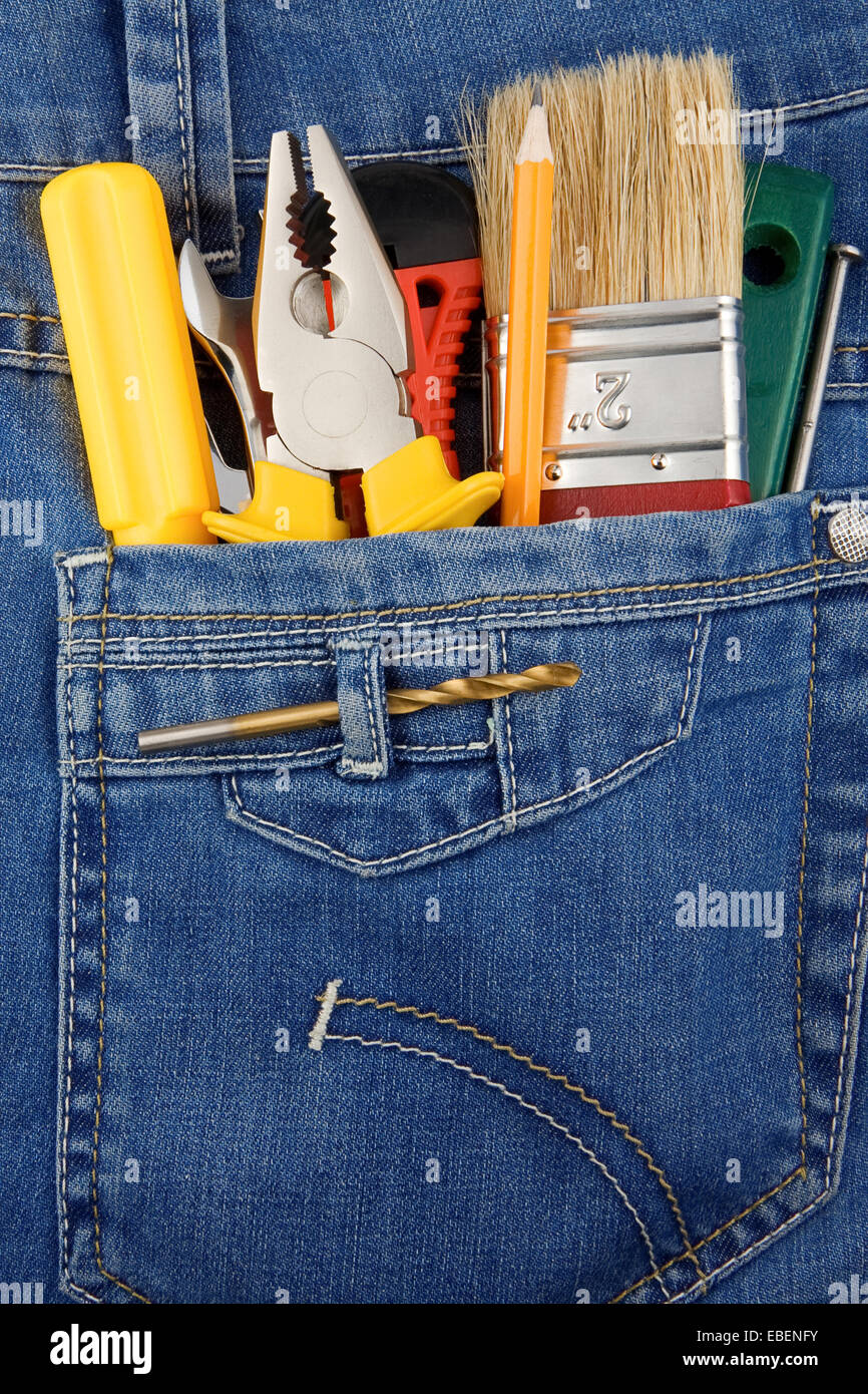 tools and instruments in blue jeans pocket Stock Photo - Alamy