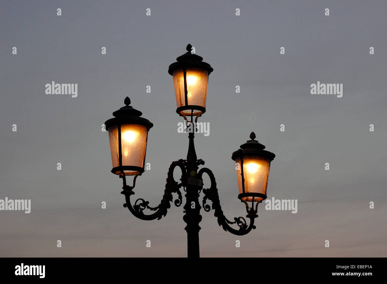 Venice Italy sunset over Venice Lagoon with street lamps Stock Photo ...