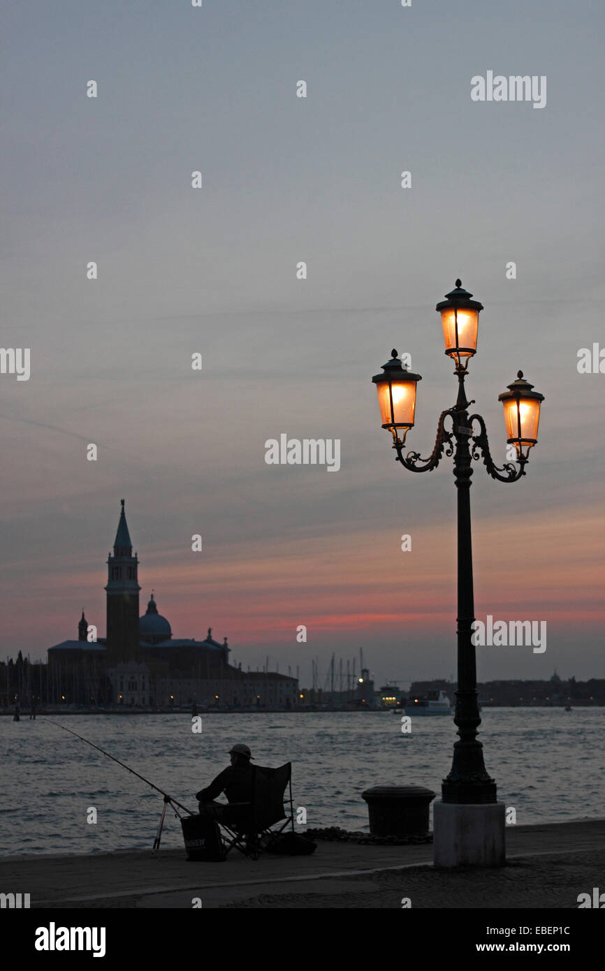Venice Italy sunset over Venice Lagoon with street lamps Stock Photo ...