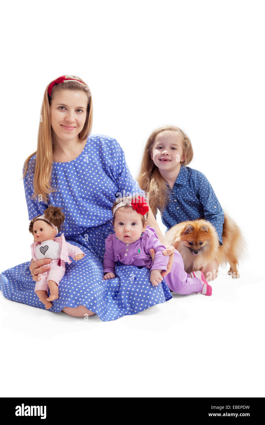 Family look photo of mother and two children with a dog Stock Photo