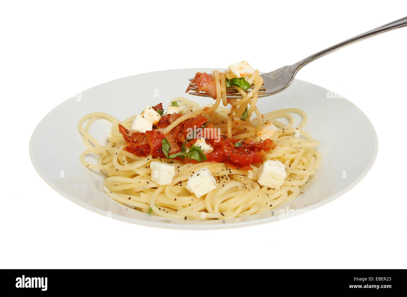 Plate of spaghetti with a fork isolated against white Stock Photo