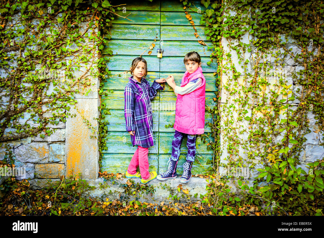 Little girls standing in front of the doors Stock Photo - Alamy