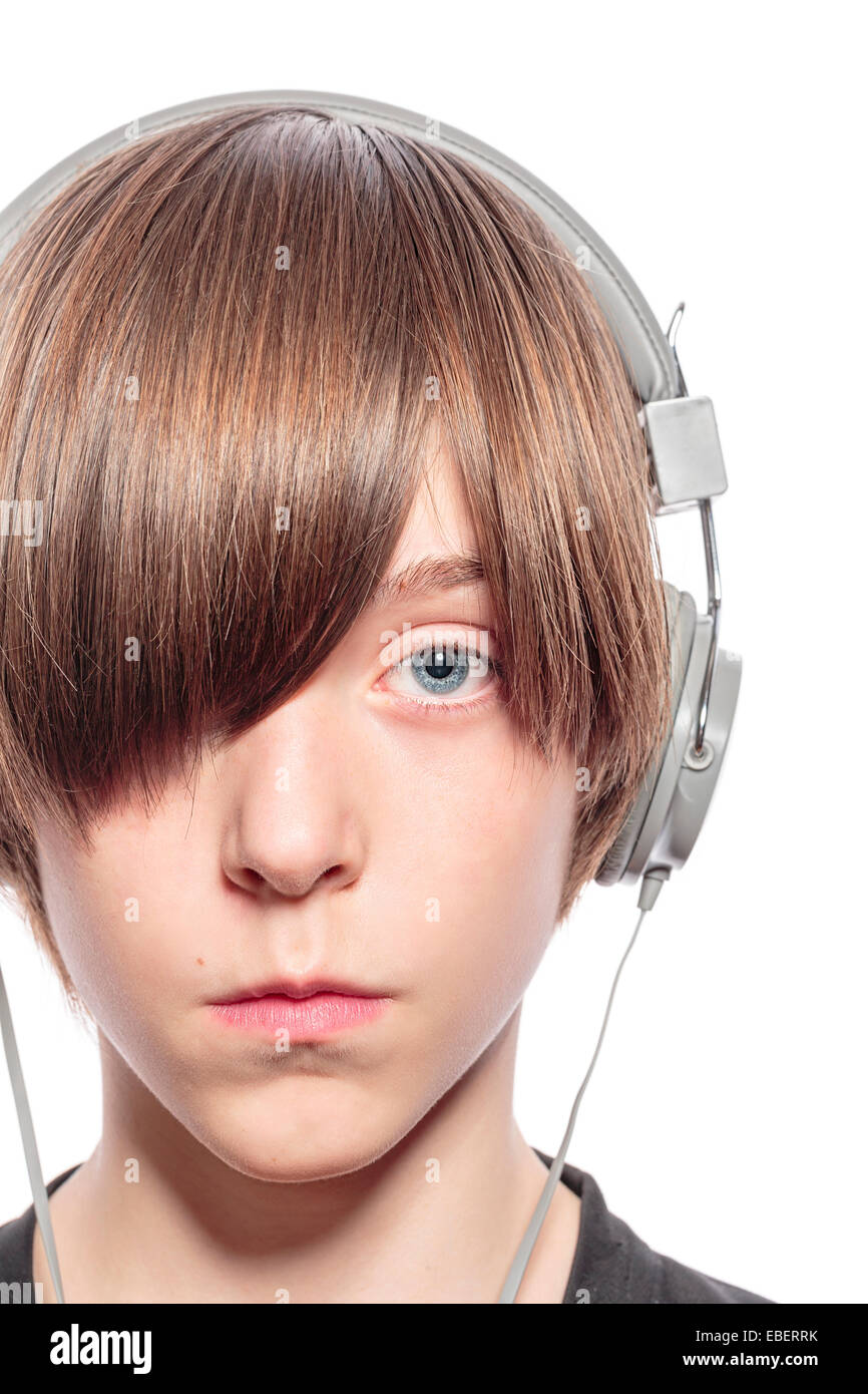 serious teenage boy with headphones, isolated on white Stock Photo