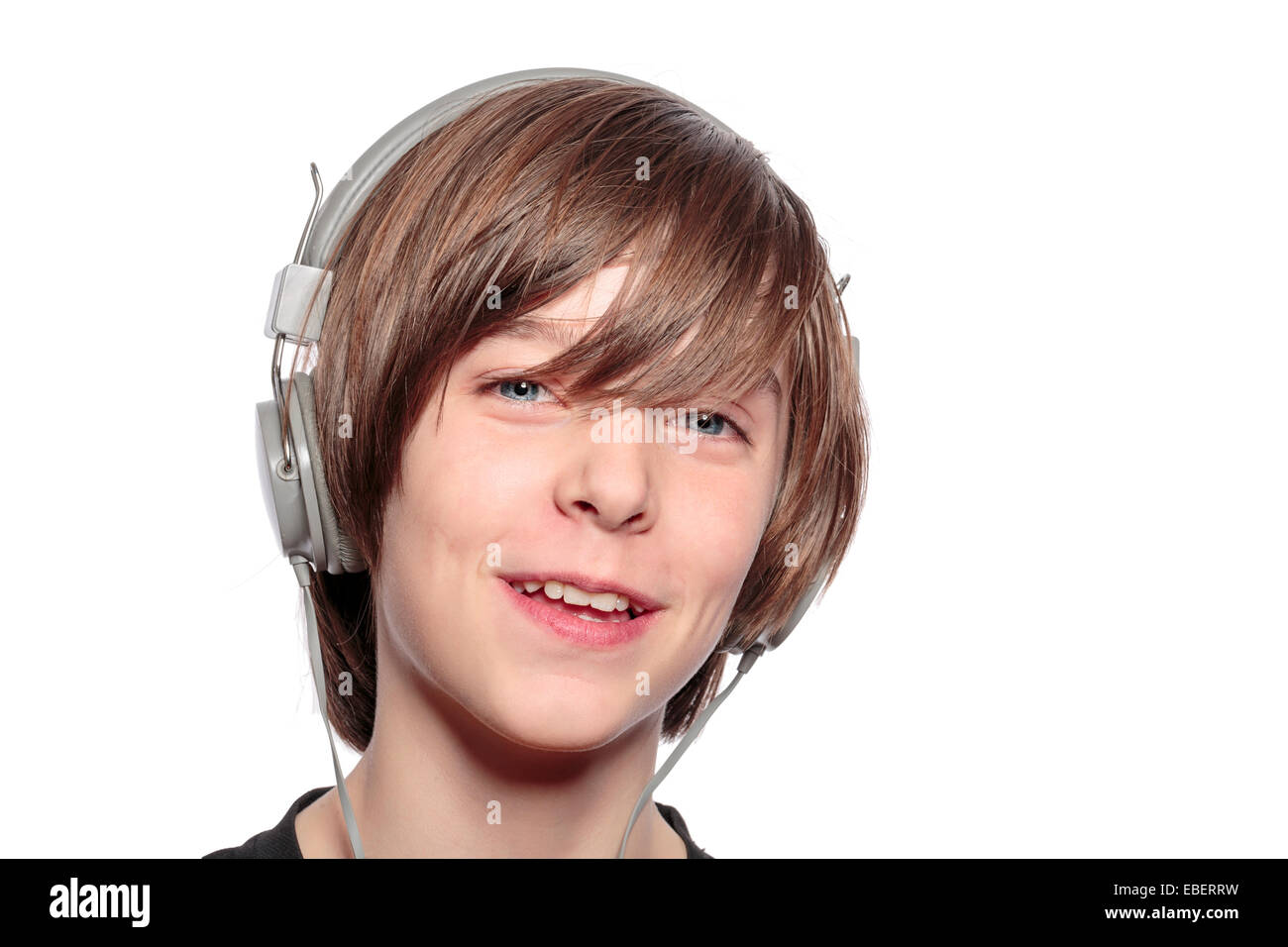 smiling teenage boy with headphones, isolated on white Stock Photo