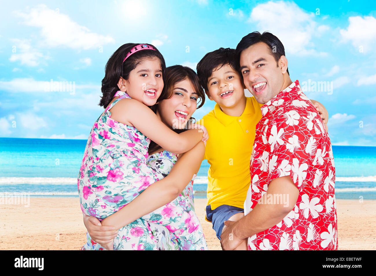 indian family goa beach standing pose Stock Photo