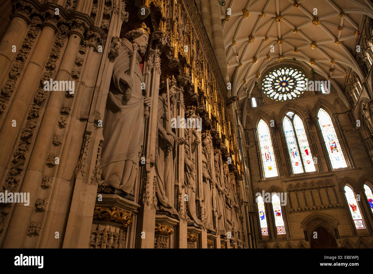Inside York Minster, looking across the statues of the Saints at the Rose Window in the South Transept Stock Photo