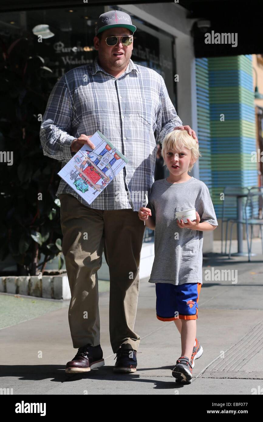 Jonah Hill takes one of his nephews out for frozen yogurt in Beverly Hills. Hill carries the tots coloring book while heading back to the car.  Featuring: Jonah Hill Where: Los Angeles, California, United States When: 27 May 2014 Stock Photo