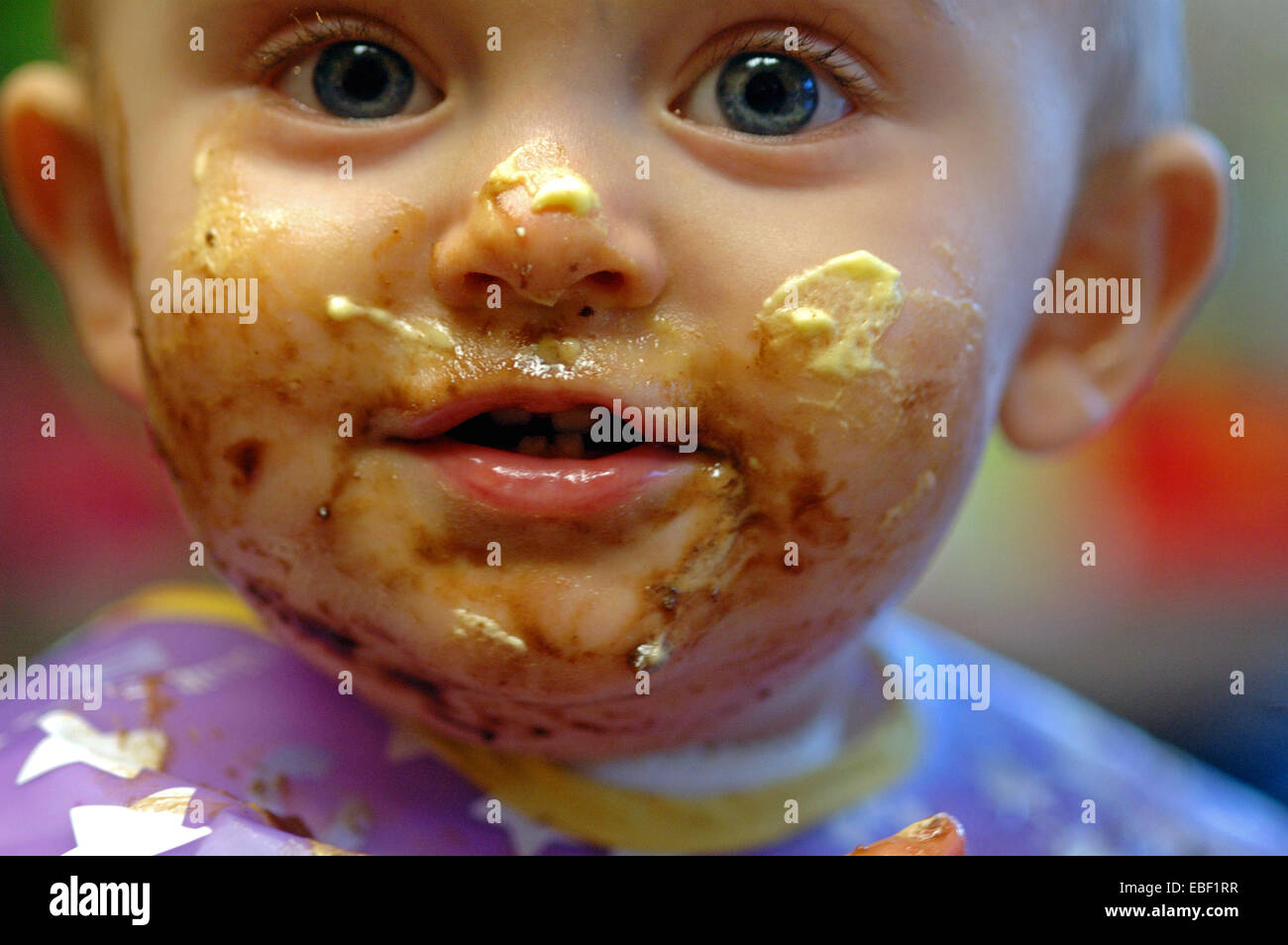Messy face baby eating cake hi-res stock photography and images - Alamy