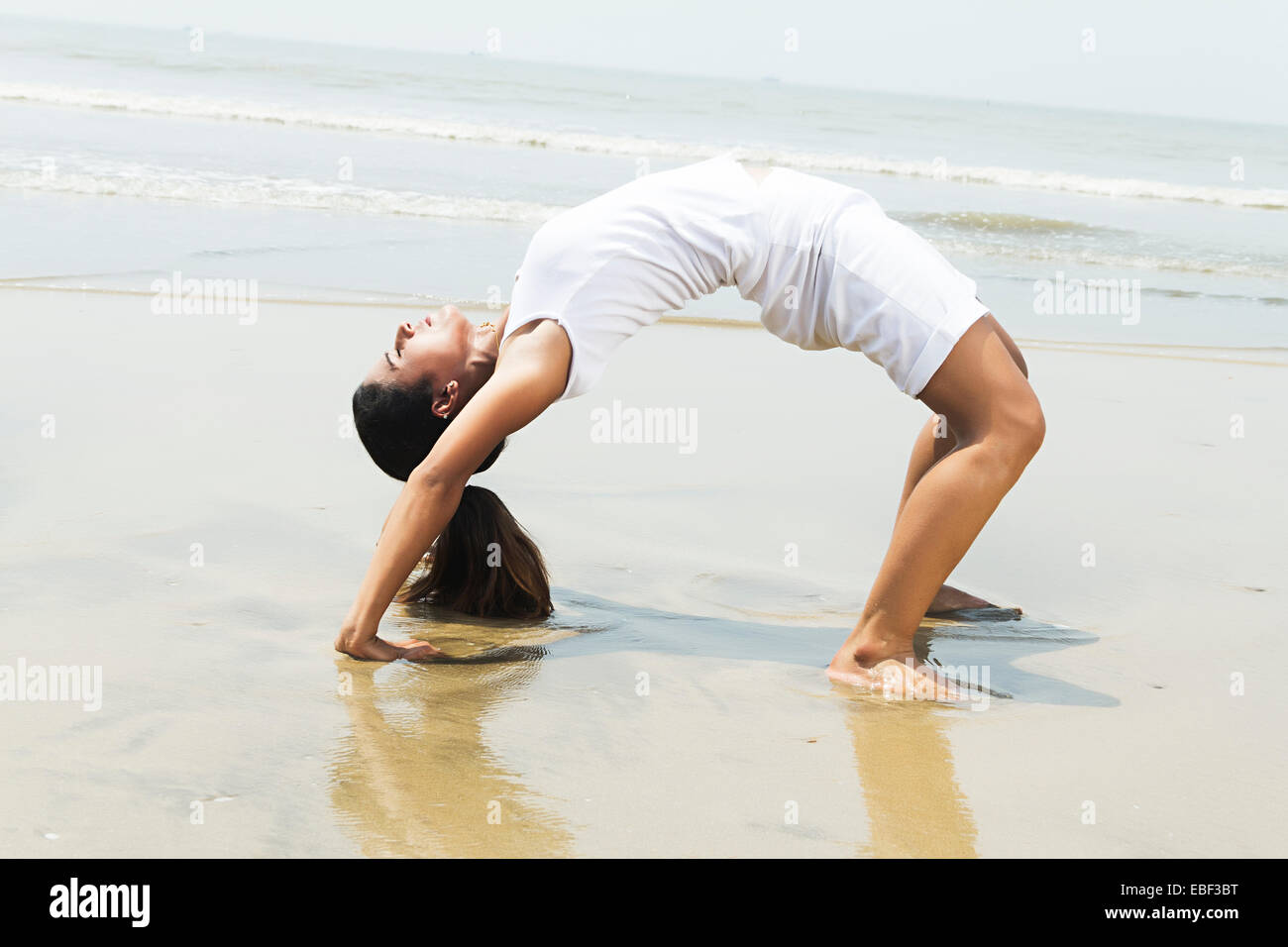 Indian Lady Beach Stretching Stock Photo - Alamy