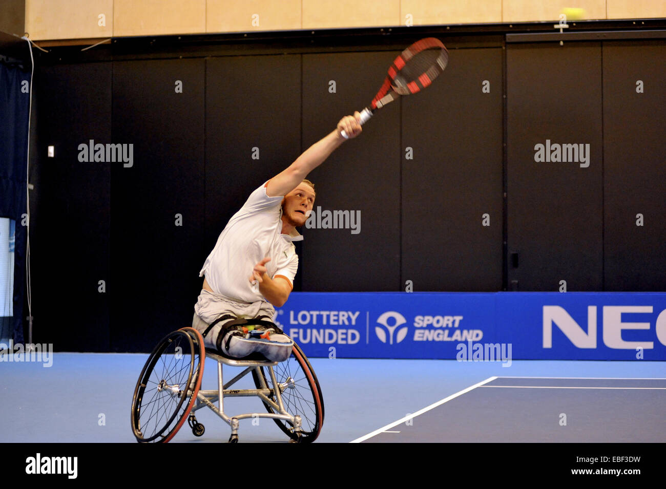 Birmingham, UK. 29th Nov, 2014. Nicolas Peifer (FR) serving during his semi final match with Maikel Scheffers (NL) at the NEC Wheelchair Tennis Masters competition. P went onto to win the match decisively with a score of 6-4, 6-1. Credit:  Michael Preston/Alamy Live News Stock Photo