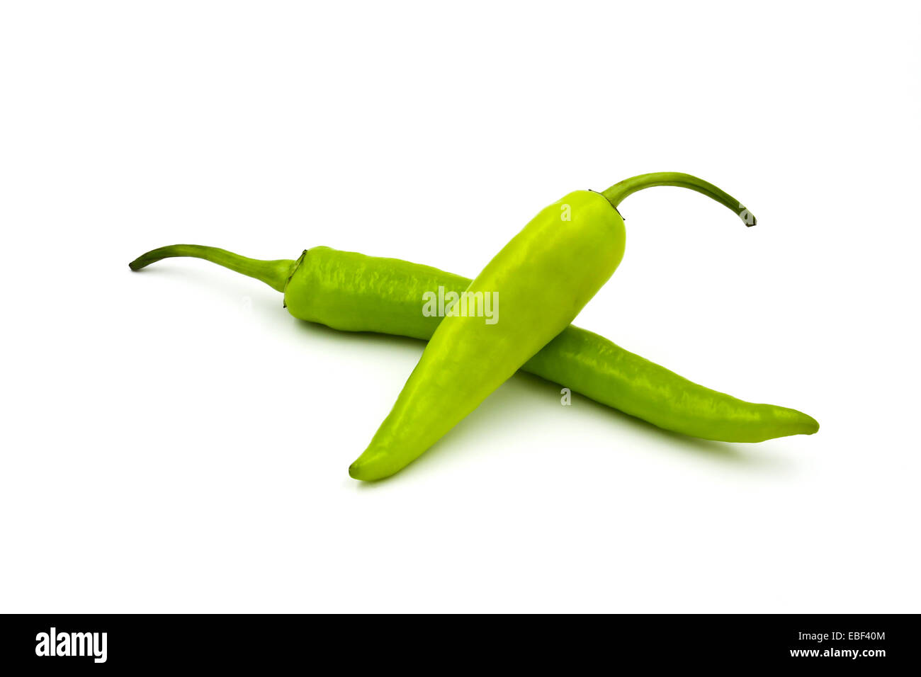 Green chili pepper isolated on a white background Stock Photo - Alamy