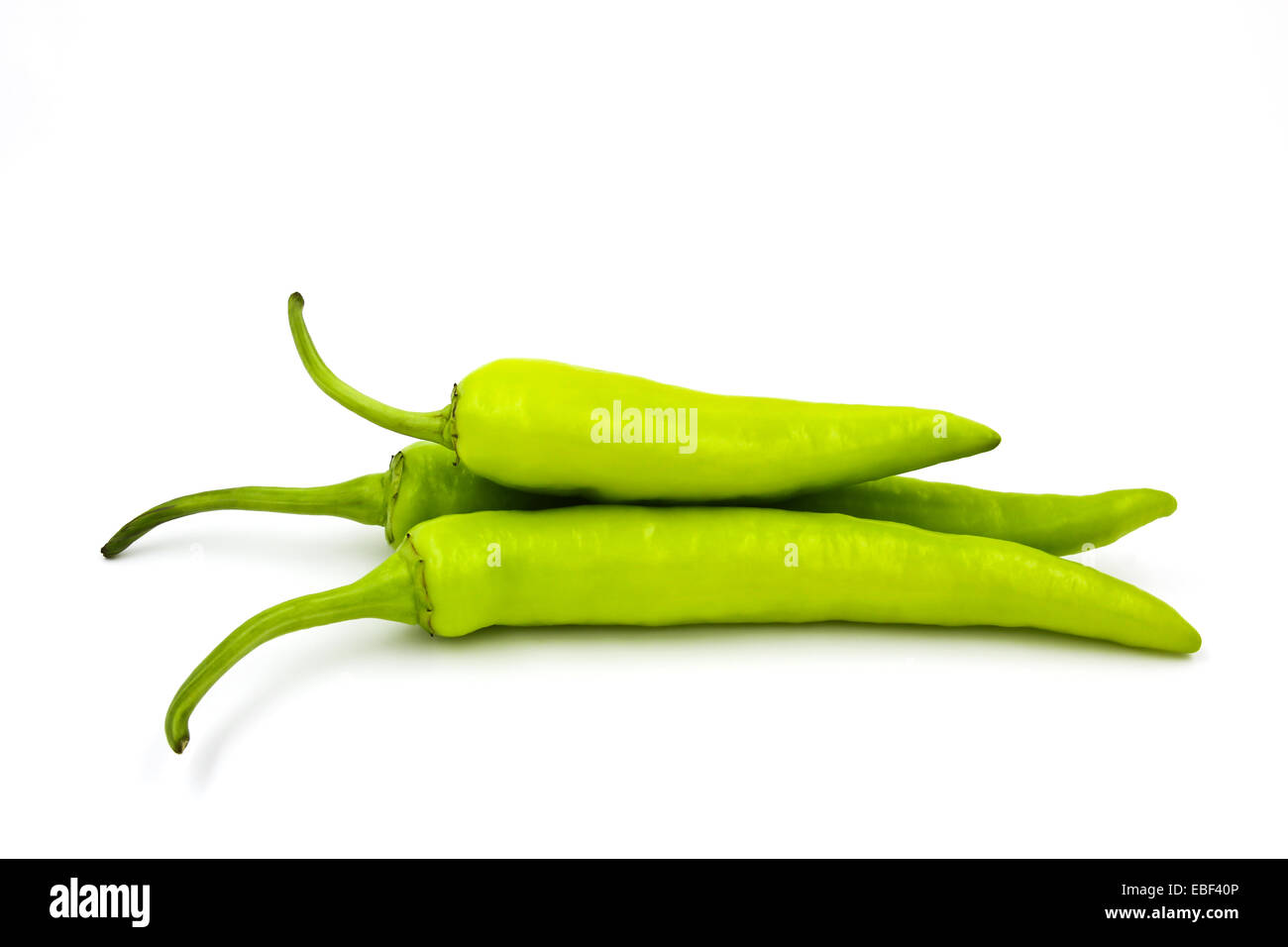 Green chili pepper isolated on a white background Stock Photo - Alamy