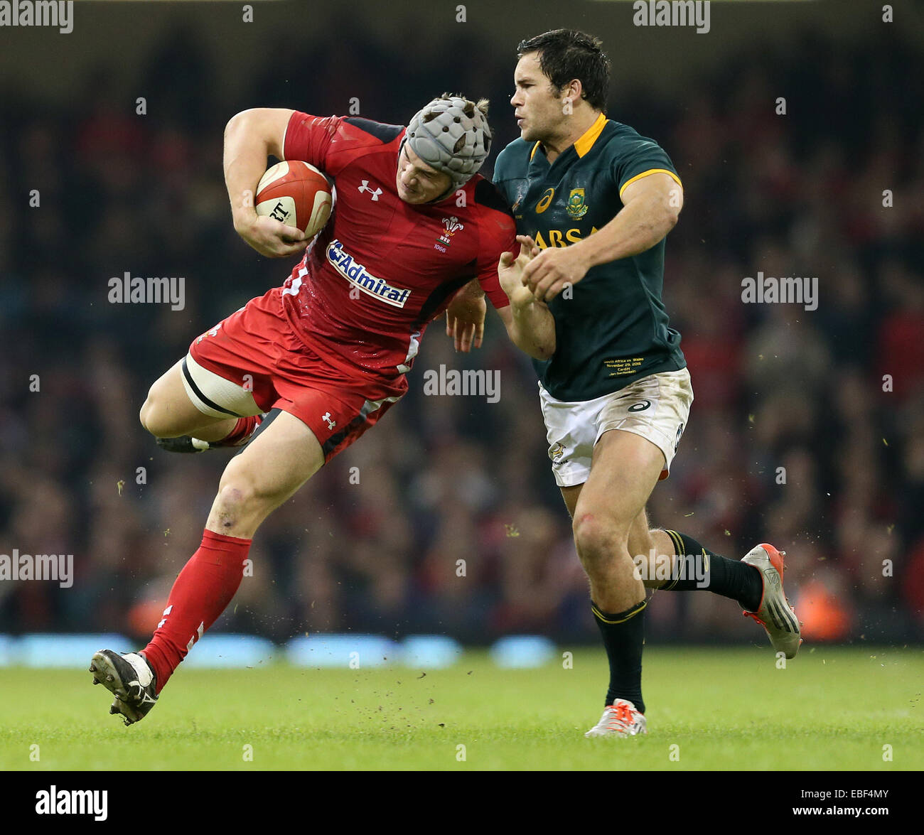 Cardiff, UK. 29th Nov, 2014. Jonathan Davies of Wales tackled by Jan Serfontein of South Africa - Autumn Internationals - Wales vs South Africa - Millennium Stadium - Cardiff - Wales - 29th November 2014 - Picture Simon Bellis/Sportimage. Credit:  csm/Alamy Live News Stock Photo