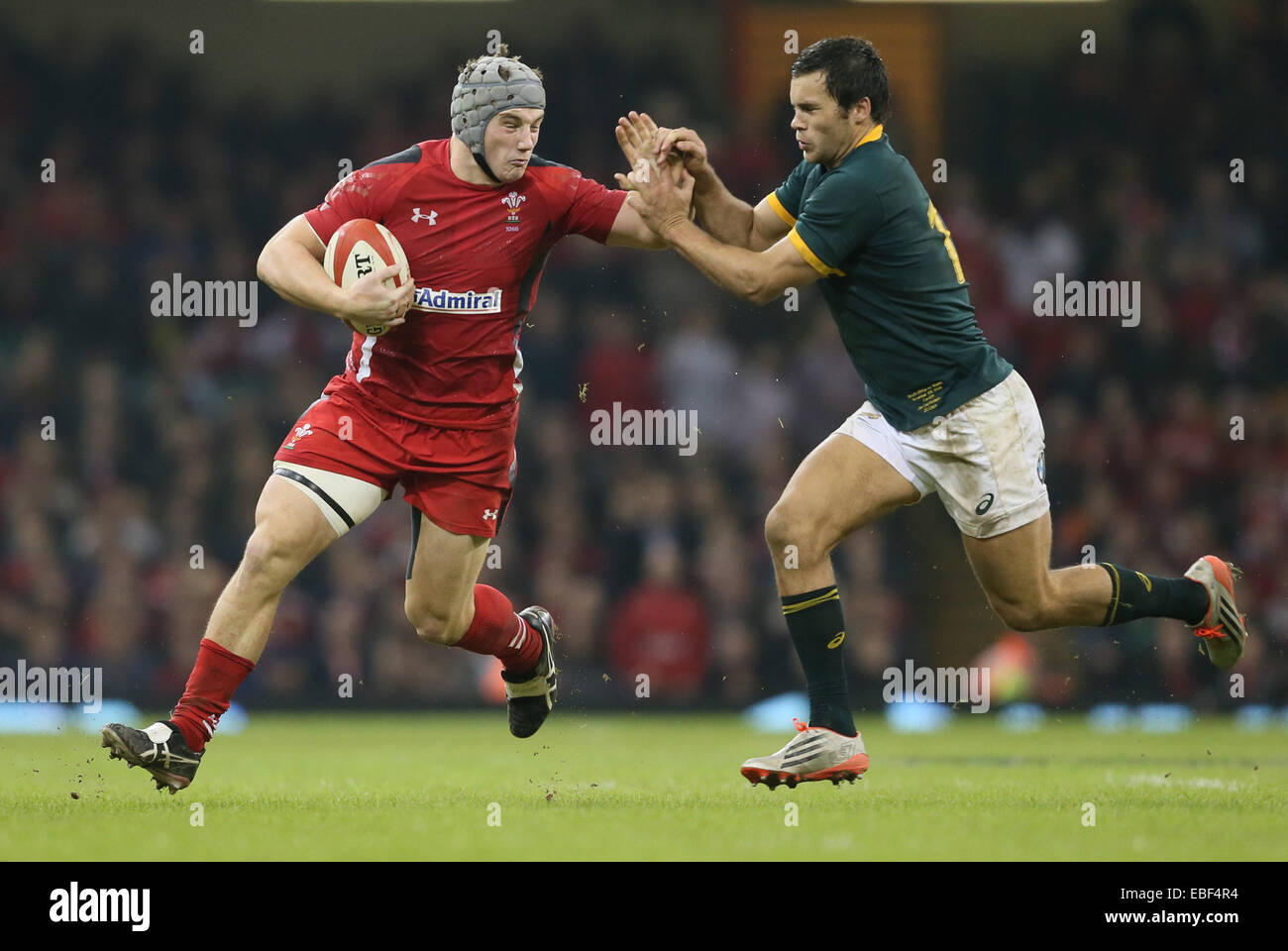 Cardiff, UK. 29th Nov, 2014. Jonathan Davies of Wales hands off Jan Serfontein of South Africa - Autumn Internationals - Wales vs South Africa - Millennium Stadium - Cardiff - Wales - 29th November 2014 - Picture Simon Bellis/Sportimage. Credit:  csm/Alamy Live News Stock Photo