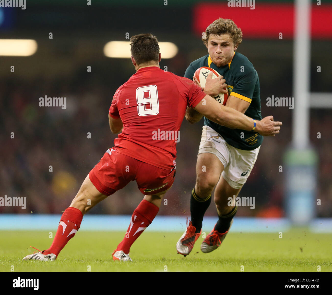 Cardiff, UK. 29th Nov, 2014. Pat Lambie of South Africa tackled by Rhys Webb of Wales - Autumn Internationals - Wales vs South Africa - Millennium Stadium - Cardiff - Wales - 29th November 2014 - Picture Simon Bellis/Sportimage. Credit:  csm/Alamy Live News Stock Photo