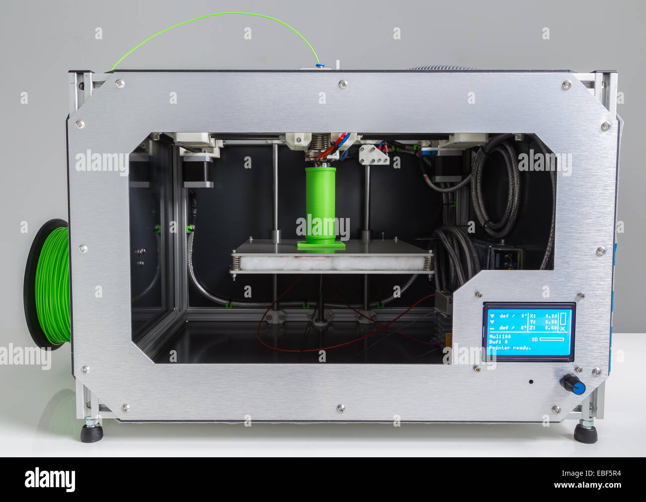 3d printer with bright green filament Stock Photo - Alamy