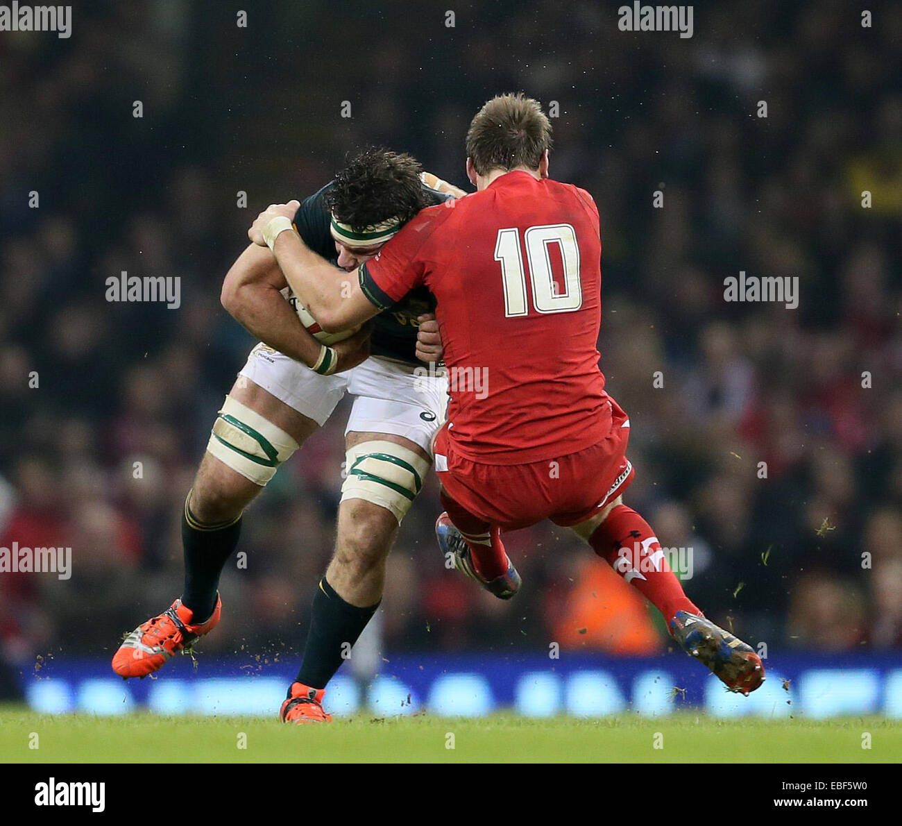 Cardiff, UK. 29th Nov, 2014. Dan Biggar of Wales brings down Marcell Coetzee of South Africa - Autumn Internationals - Wales vs South Africa - Millennium Stadium - Cardiff - Wales - 29th November 2014 - Picture Simon Bellis/Sportimage. Credit:  csm/Alamy Live News Stock Photo