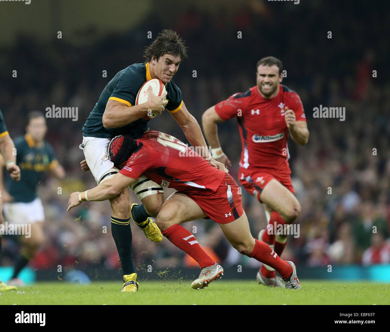 Cardiff, UK. 29th Nov, 2014. Last man Leigh Halfpenny of Wales brings down Eben Etzebeth of South Africa - Autumn Internationals - Wales vs South Africa - Millennium Stadium - Cardiff - Wales - 29th November 2014 - Picture Simon Bellis/Sportimage. Credit:  csm/Alamy Live News Stock Photo