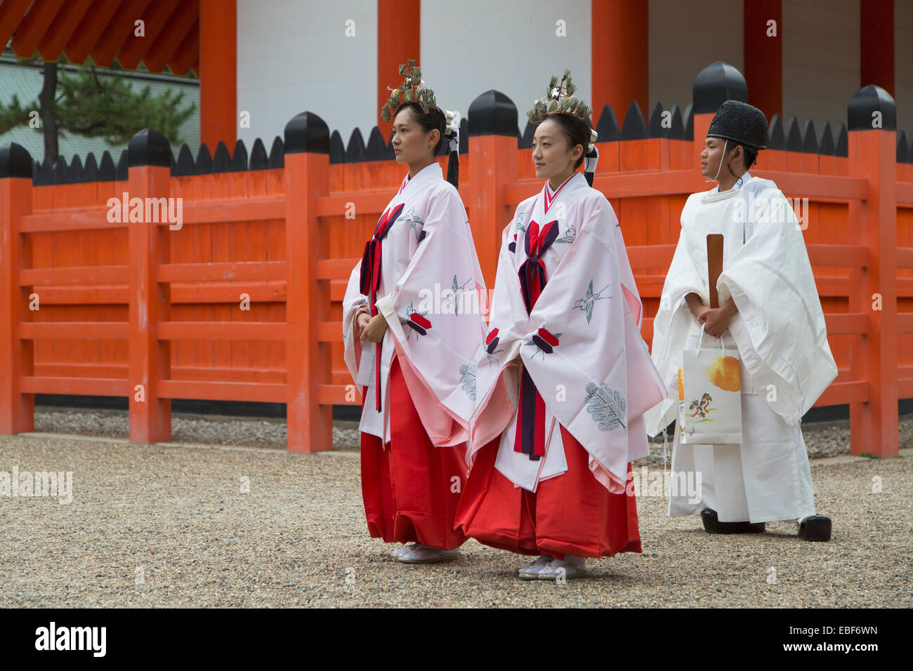 Shrine Maidens And Priest At Traditional Wedding Ceremony At Shinto Shrine Of Sumiyoshi Taisha 