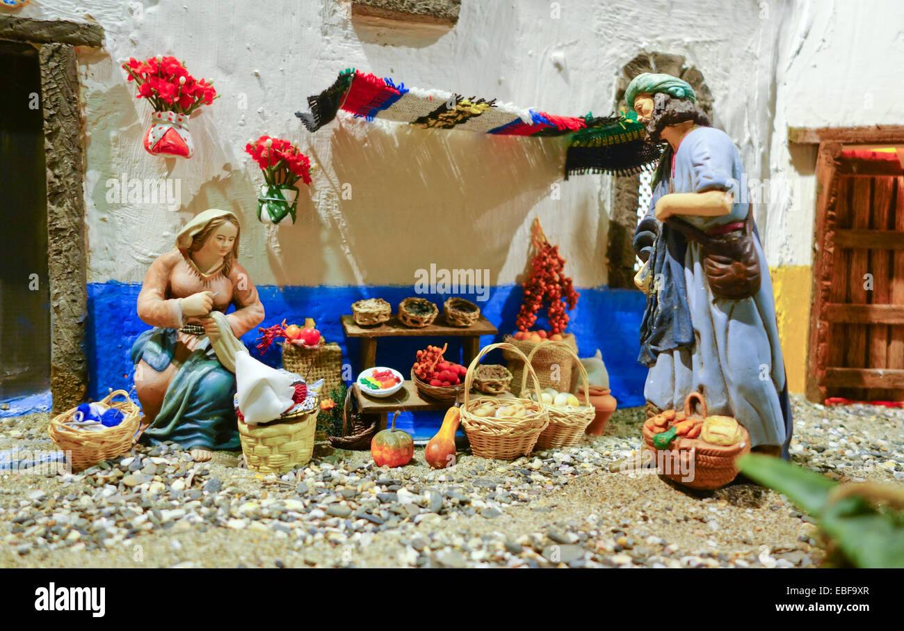 Nativity Scene of a Belen, bethlehem, Christmas Spain. woman vendor vegetables. figures. spanish tradition. Catholic. Stock Photo