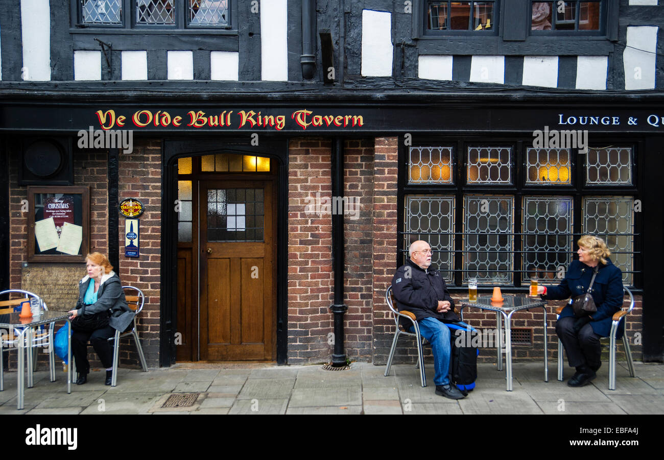 People sitting at tables outside 'ye olde Bull Ring Tavern' public house in Ludlow Shropshire Stock Photo