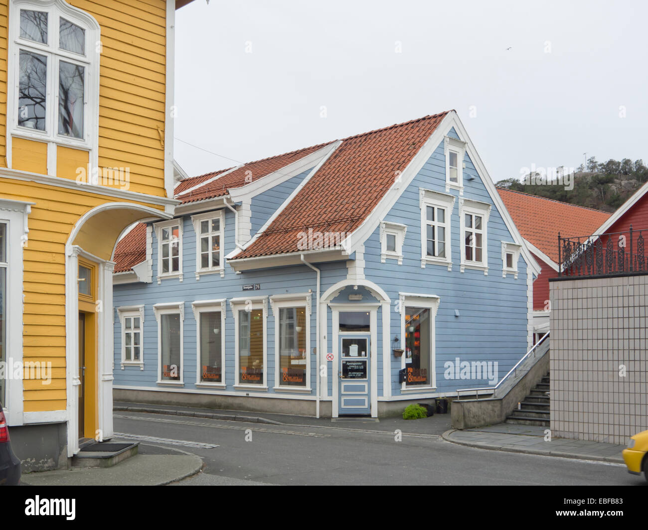 Street corner in the center of the small Norwegian town Egersund, wooden paneled colourful houses and shops Stock Photo