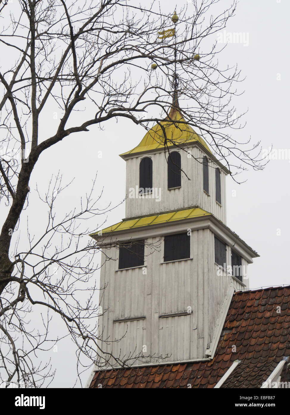 Steeple on an old wood paneled Evangelic Lutheran church in the small Norwegian town Egersun Stock Photo