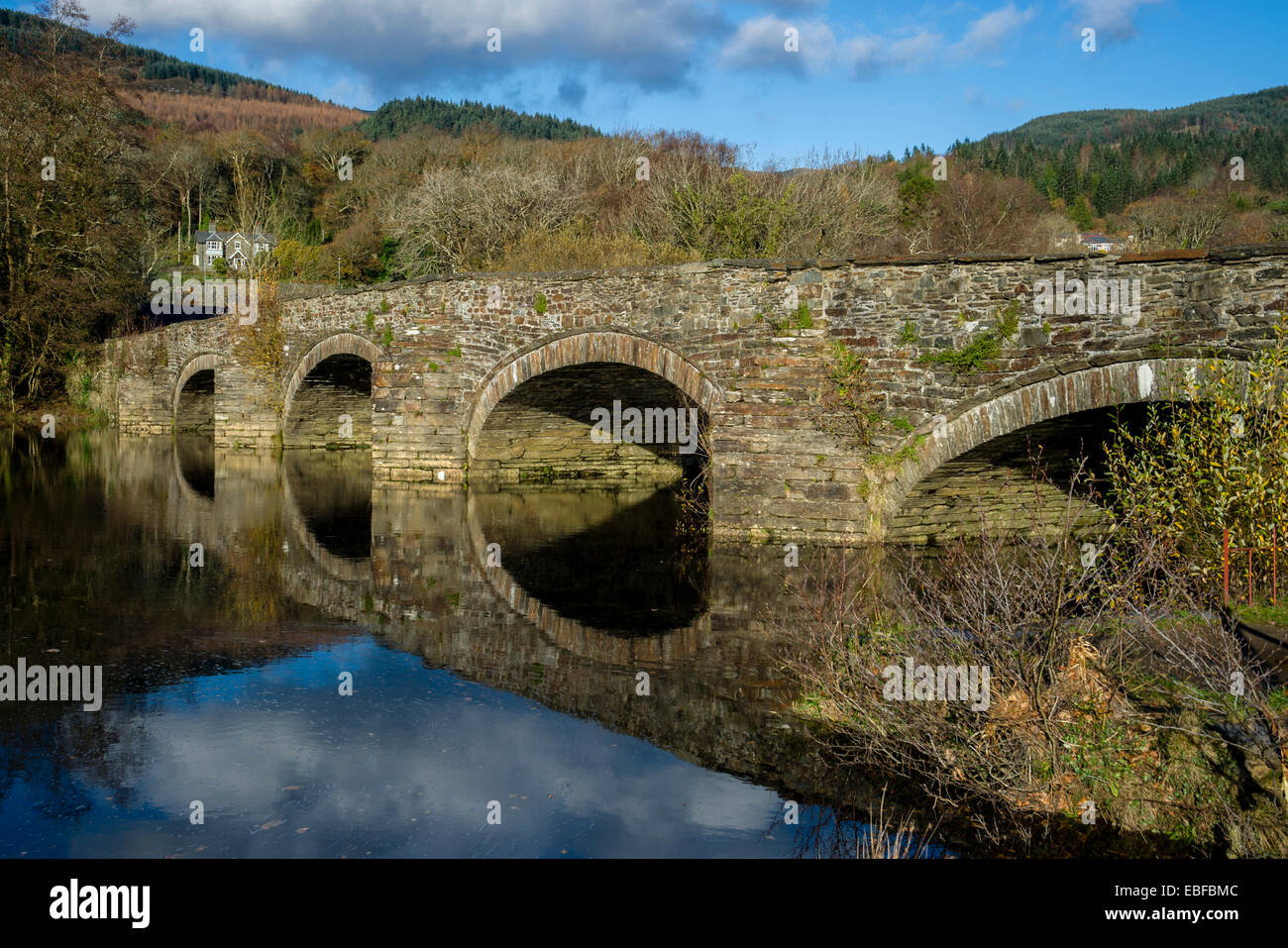A stone bridge over the River Wnion just outside Dolgellau Snowdonia North Wales Stock Photo