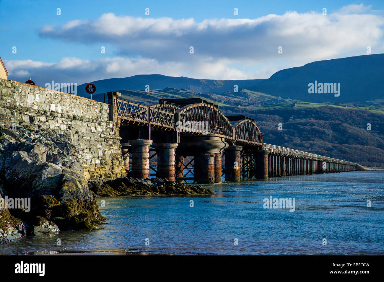 The rail and footbridge over the Mawddach estuary Barmouth Snowdonia Gwynedd North Wales Stock Photo