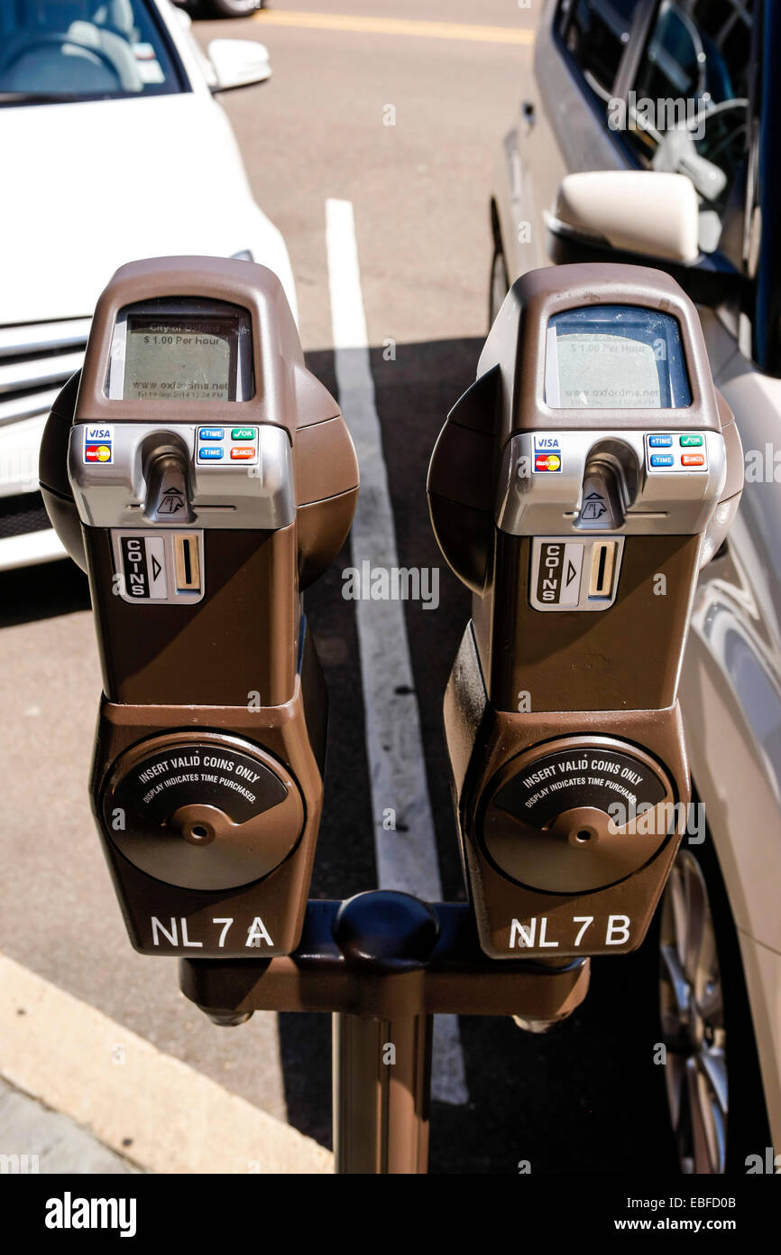 Two solar powered vehicle parking meters Stock Photo