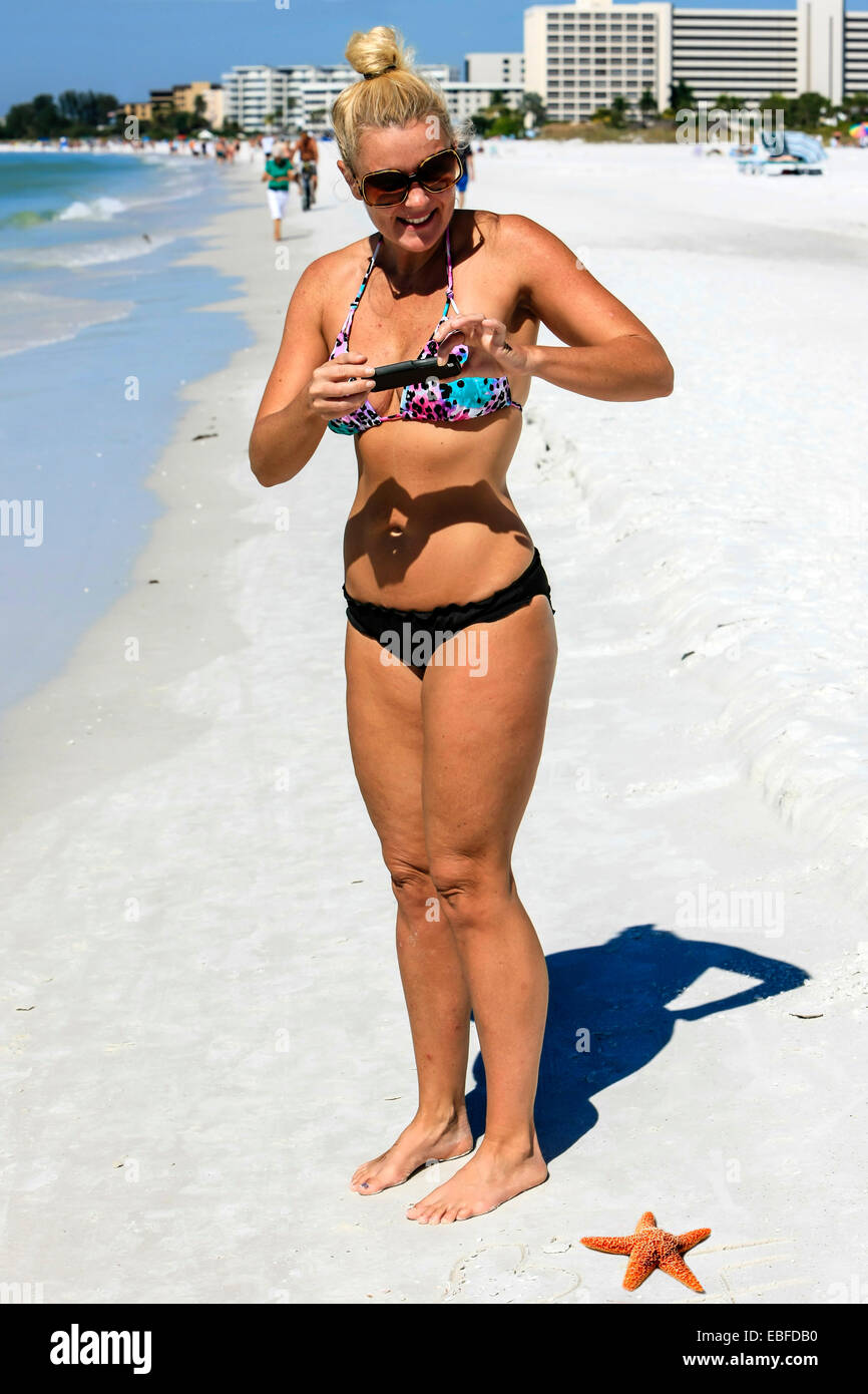 young slim woman, beautiful perfect body, tanned skin, bikini swimsuit  Stock Photo by marymandarinka