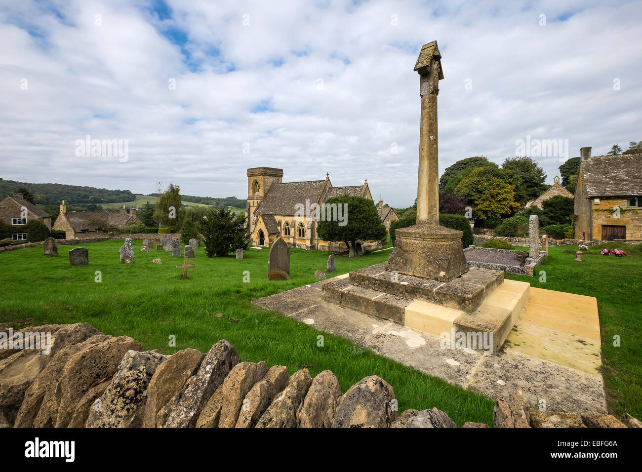 War memorial and St Barnabas Church Snowshill village The Cotswolds Gloucestershire England Stock Photo